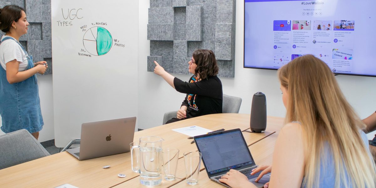 A group participates in an office workshop, symbolizing the importance of training and fostering a culture of AI verification.