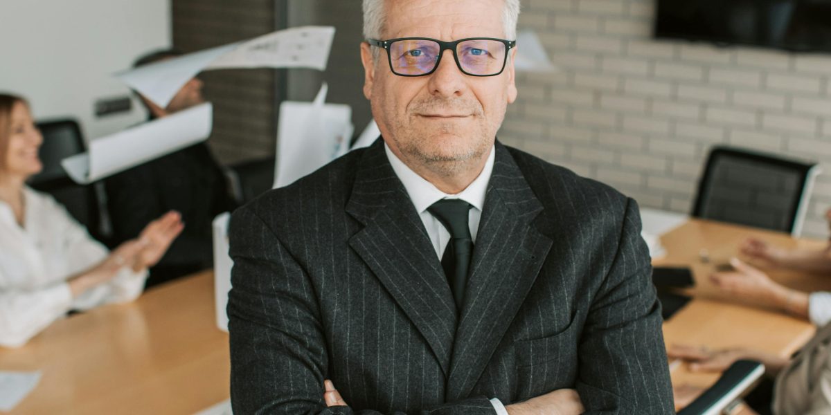 A pensive business leader contemplating the implications of AI inaccuracies and the rising cost of hallucinations in enterprise operations.