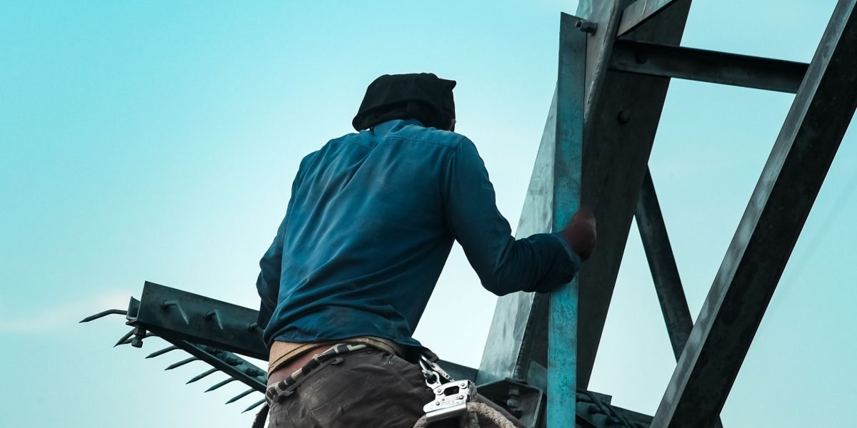 An individual reviewing plans or setting up preventative measures, embodying the proactive approach of AI guardrail platforms.