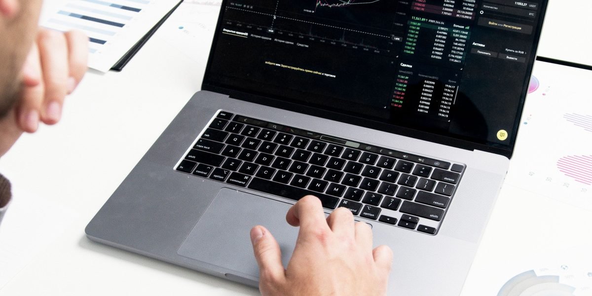 A professional analyzing data and reports, illustrating the importance of measuring training effectiveness and tracking key cybersecurity metrics.