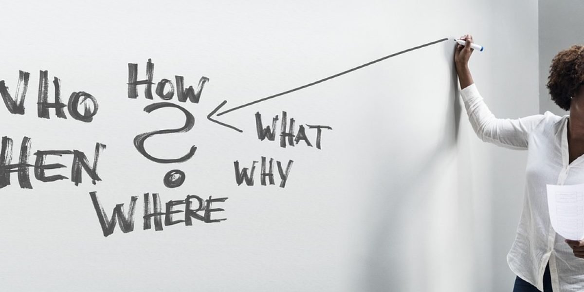 A professional critically evaluates options on a whiteboard, symbolizing the process of assessing stealth AI tools using a capabilities checklist.