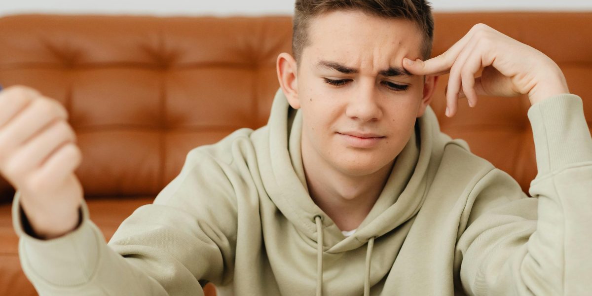 A person engaged in deep thought, symbolizing the analytical process required to understand and address AI hallucination mechanics.