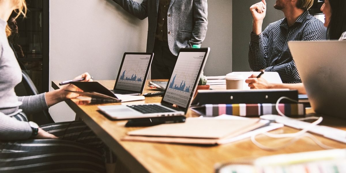 A team of professionals in a serious discussion, addressing a critical error or challenge.