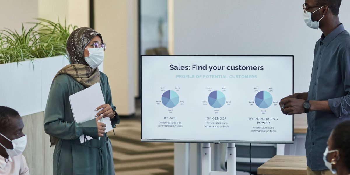 A confident person presenting advanced technology solutions, possibly discussing AI verification in cybersecurity.