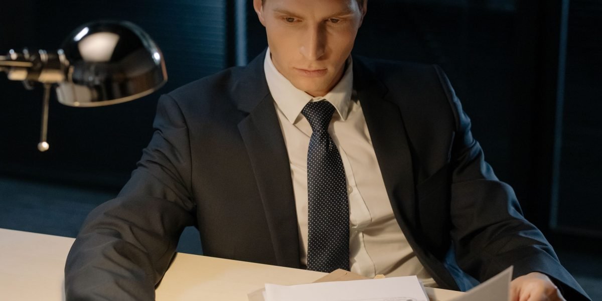 A person diligently reviewing a document with a skeptical mindset, embodying the essential act of verifying AI-generated information.