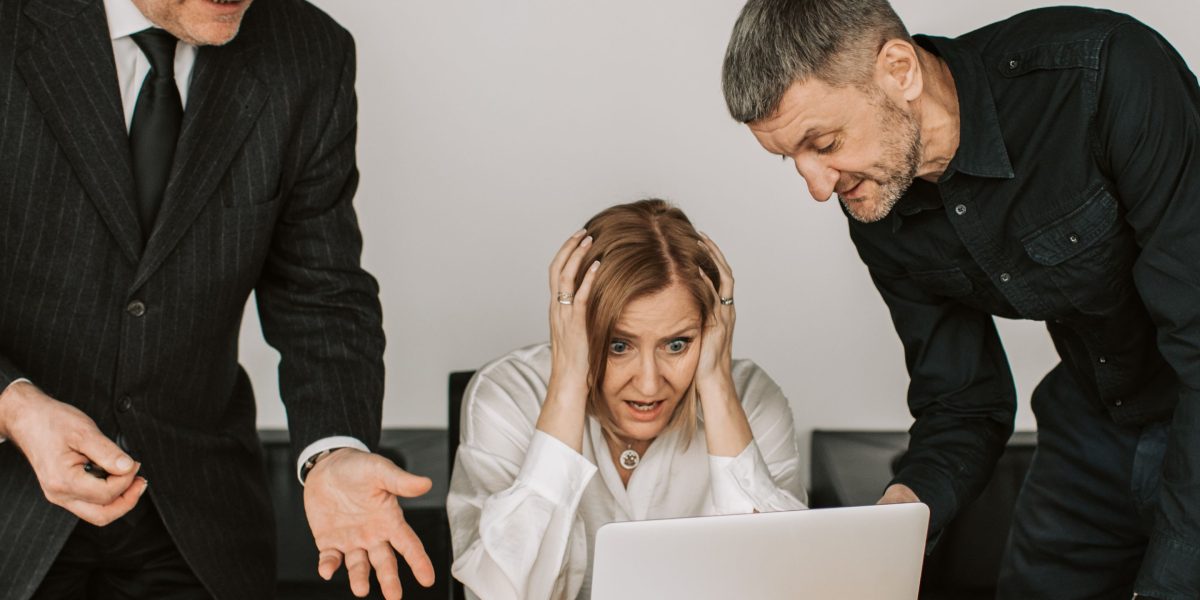 Executives discussing critical business decisions impacted by unreliable AI outputs.