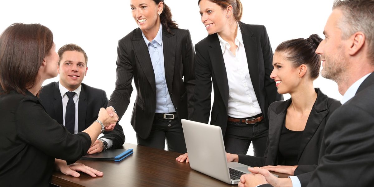 Professionals reviewing governance and compliance documents, ensuring AI systems adhere to regulations and internal policies.